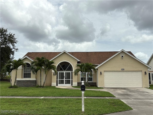 1118 Grove Dr, Naples, FL 34120 - single story home with stucco siding, a garage, concrete driveway, and a front yard