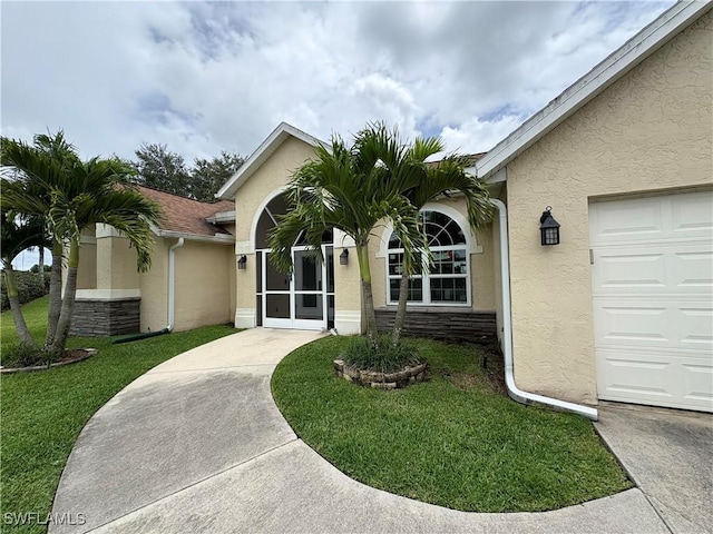 1118 Grove Dr, Naples, FL 34120 - view of front of home with stucco siding and a front lawn
