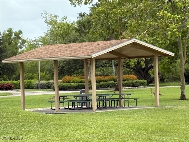 1118 Grove Dr, Naples, FL 34120 - view of property's community featuring a lawn