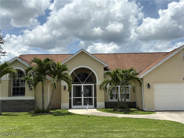 1118 Grove Dr, Naples, FL 34120 - view of front of property featuring stucco siding, a front yard, a shingled roof, an attached garage, and concrete driveway