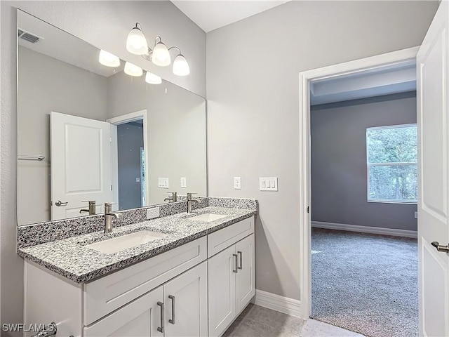 3307 55th St W, Lehigh Acres, FL 33971 - bathroom with double vanity and baseboards