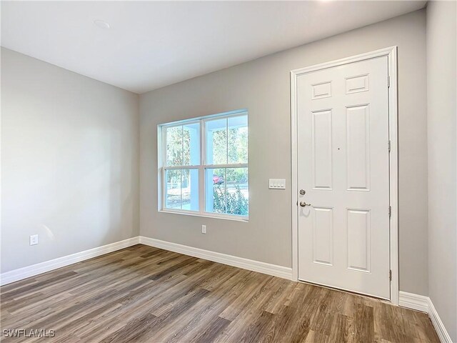 3307 55th St W, Lehigh Acres, FL 33971 - entrance foyer with wood finished floors and baseboards