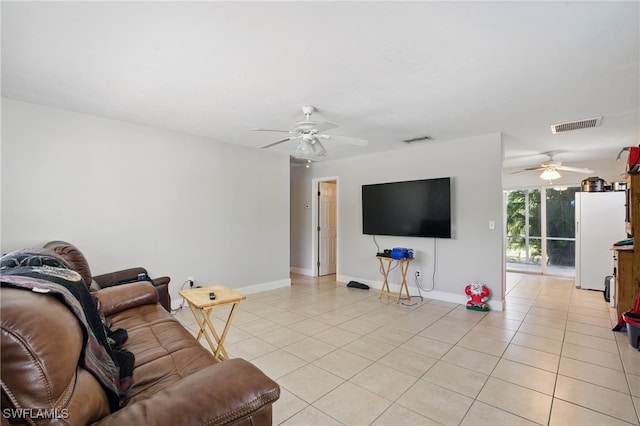 11580 Dean St Unit 582, Bonita Springs, FL 34135 - living area featuring a ceiling fan, light tile patterned floors, and baseboards