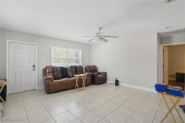 11580 Dean St Unit 582, Bonita Springs, FL 34135 - living area featuring ceiling fan, light tile patterned floors, and baseboards