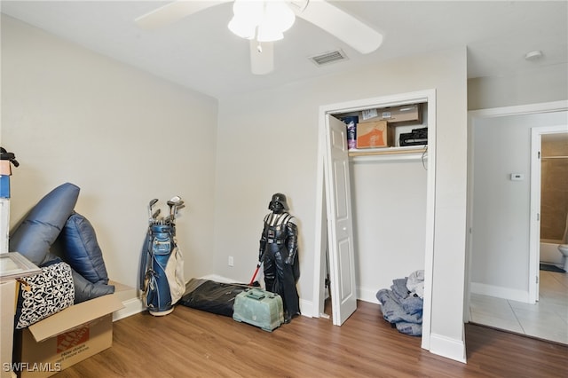 11580 Dean St Unit 582, Bonita Springs, FL 34135 - bedroom with wood finished floors, a ceiling fan, a closet, and baseboards