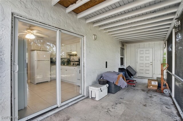 11580 Dean St Unit 582, Bonita Springs, FL 34135 - unfurnished sunroom with ceiling fan and a sink