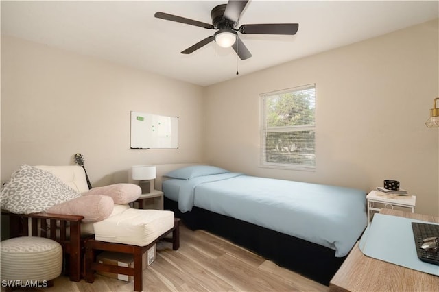 11580 Dean St Unit 582, Bonita Springs, FL 34135 - bedroom featuring light wood-style floors and ceiling fan