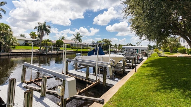 3711 Del Prado Blvd S Unit 2, Cape Coral, FL 33904 - dock area featuring boat lift, a water view, and a yard