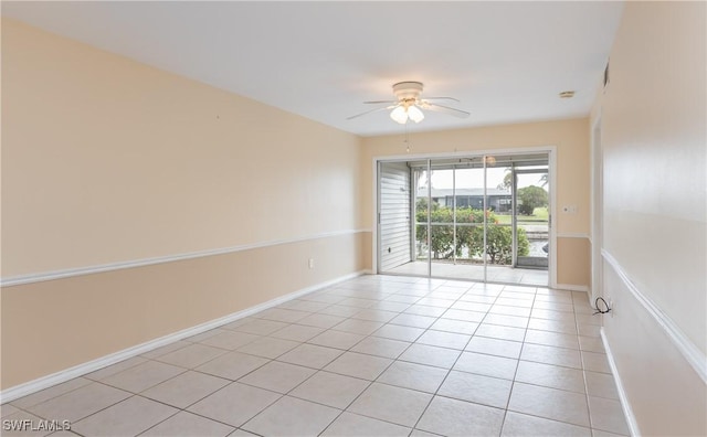 3711 Del Prado Blvd S Unit 2, Cape Coral, FL 33904 - empty room featuring a ceiling fan, light tile patterned floors, and baseboards