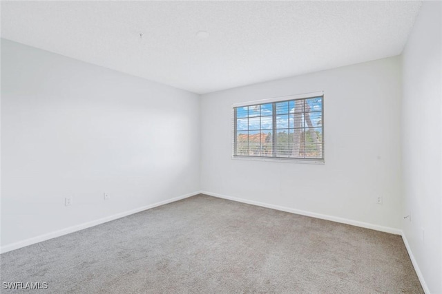 1205 Wildwood Lakes Blvd Unit 305, Naples, FL 34104 - spare room with carpet floors and baseboards