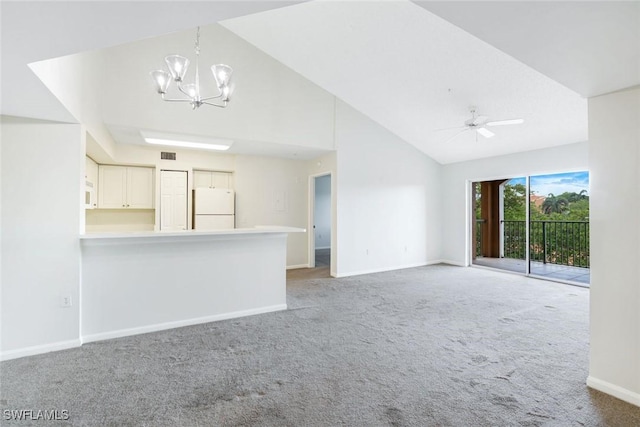 1205 Wildwood Lakes Blvd Unit 305, Naples, FL 34104 - unfurnished living room featuring a chandelier, light carpet, high vaulted ceiling, and a ceiling fan