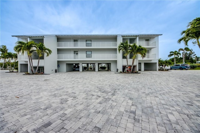 16641 Stringfellow Rd Unit 506, Bokeelia, FL 33922 - view of building exterior with a carport and driveway