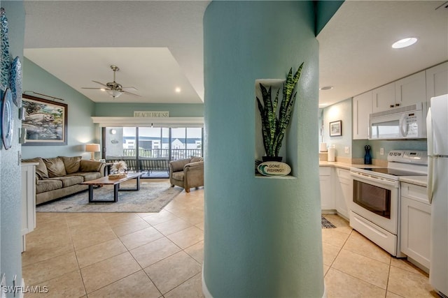 16641 Stringfellow Rd Unit 506, Bokeelia, FL 33922 - living area with a ceiling fan, lofted ceiling, light tile patterned flooring, and recessed lighting