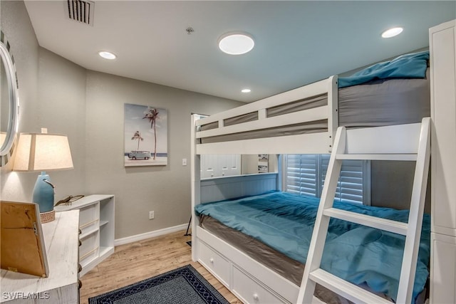 16641 Stringfellow Rd Unit 506, Bokeelia, FL 33922 - bedroom featuring wood finished floors, baseboards, and recessed lighting