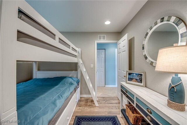 16641 Stringfellow Rd Unit 506, Bokeelia, FL 33922 - bedroom featuring light wood finished floors, recessed lighting, and baseboards