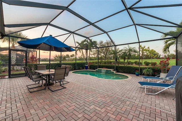 10412 Materita Dr, Fort Myers, FL 33913 - pool at dusk featuring a patio area, an outdoor pool, and a lanai