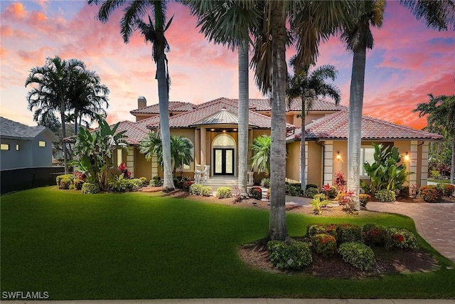 1658 Mcilvaine Ct, Marco Island, FL 34145 - view of front facade with stucco siding, a front yard, a tiled roof, and a chimney