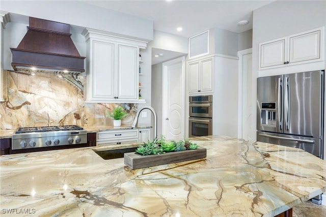 1658 Mcilvaine Ct, Marco Island, FL 34145 - kitchen with custom range hood, stainless steel appliances, decorative backsplash, open shelves, and a sink