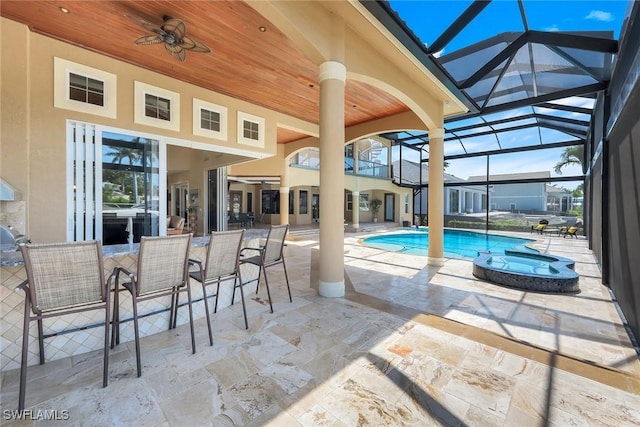 1658 Mcilvaine Ct, Marco Island, FL 34145 - view of pool with a patio area, a ceiling fan, a pool with connected hot tub, and a lanai