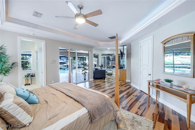 1658 Mcilvaine Ct, Marco Island, FL 34145 - bedroom with a raised ceiling, light wood finished floors, ceiling fan, and baseboards
