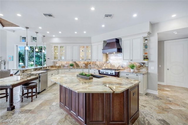 1658 Mcilvaine Ct, Marco Island, FL 34145 - kitchen with a sink, wall chimney exhaust hood, dishwasher, stone tile floors, and recessed lighting