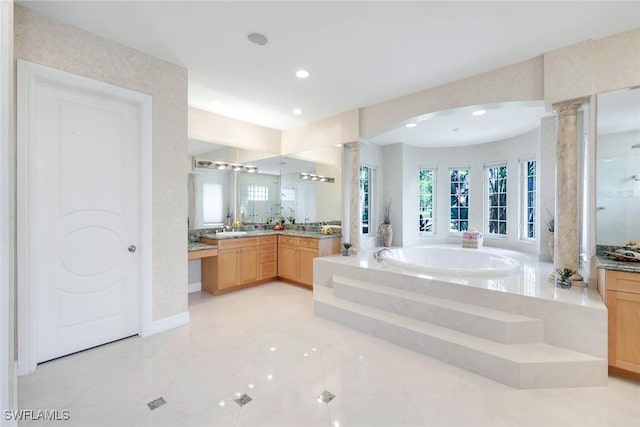 1658 Mcilvaine Ct, Marco Island, FL 34145 - full bathroom with decorative columns, vanity, a garden tub, and recessed lighting