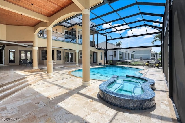 1658 Mcilvaine Ct, Marco Island, FL 34145 - view of swimming pool featuring a pool with connected hot tub, a patio area, and glass enclosure