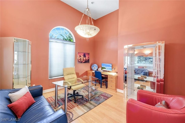 1658 Mcilvaine Ct, Marco Island, FL 34145 - home office with high vaulted ceiling, wood finished floors, and baseboards