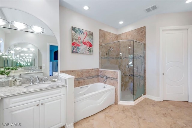 1658 Mcilvaine Ct, Marco Island, FL 34145 - full bath featuring a bath, a shower stall, vanity, marble finish floors, and recessed lighting