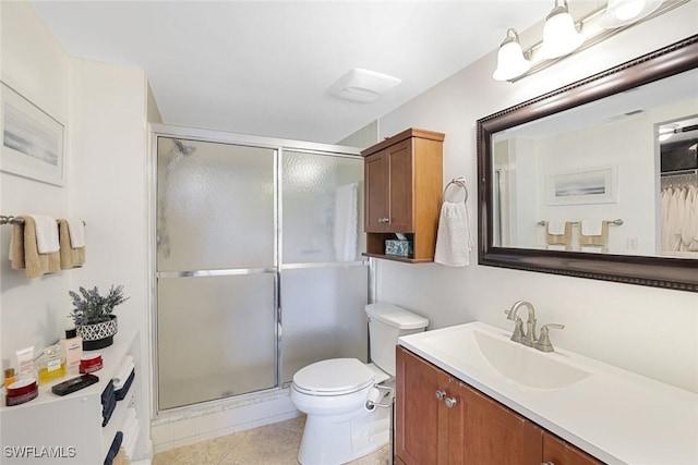 1250 Yesica Ann Cir Unit E106, Naples, FL 34110 - full bath with vanity, a stall shower, toilet, and tile patterned floors