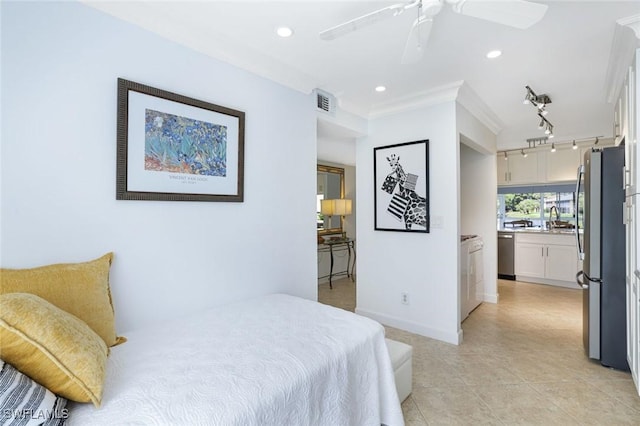 1250 Yesica Ann Cir Unit E106, Naples, FL 34110 - bedroom featuring freestanding refrigerator, recessed lighting, light tile patterned floors, washer / clothes dryer, and a sink