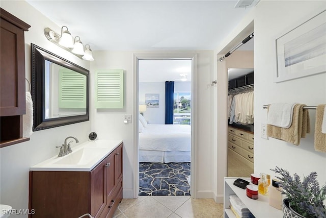 1250 Yesica Ann Cir Unit E106, Naples, FL 34110 - full bath featuring vanity, ensuite bath, and tile patterned floors