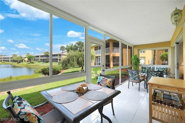 1250 Yesica Ann Cir Unit E106, Naples, FL 34110 - sunroom / solarium featuring a water view