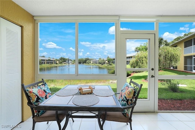 1250 Yesica Ann Cir Unit E106, Naples, FL 34110 - sunroom / solarium with a water view
