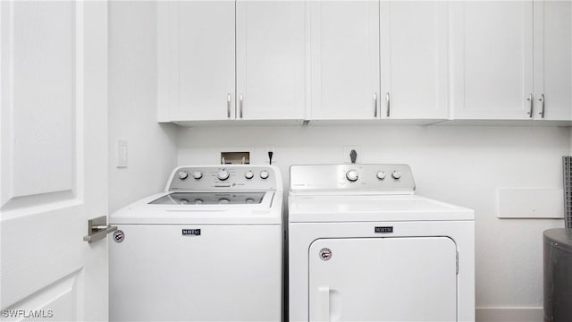 9640 Victoria Ln Unit C308, Naples, FL 34109 - laundry room with washing machine and dryer and cabinet space