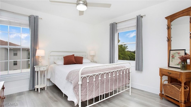 9640 Victoria Ln Unit C308, Naples, FL 34109 - bedroom featuring wood finished floors, ceiling fan, and baseboards