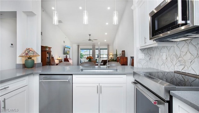 9640 Victoria Ln Unit C308, Naples, FL 34109 - kitchen featuring stainless steel appliances, decorative backsplash, ceiling fan, white cabinetry, and recessed lighting