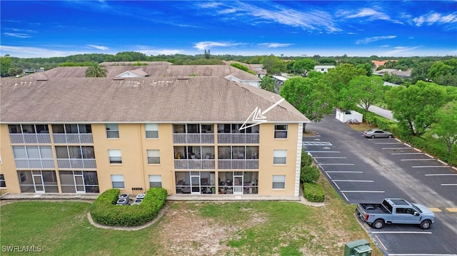 9640 Victoria Ln Unit C308, Naples, FL 34109 - view of building exterior featuring uncovered parking