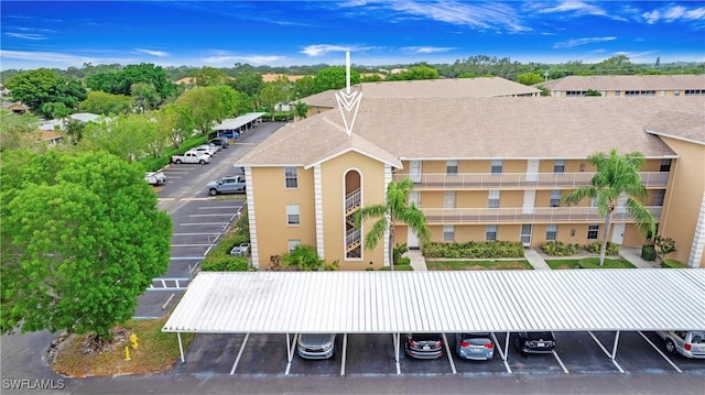 9640 Victoria Ln Unit C308, Naples, FL 34109 - view of building exterior featuring uncovered parking