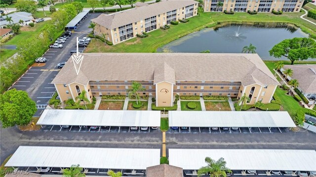 9640 Victoria Ln Unit C308, Naples, FL 34109 - drone / aerial view of a large body of water and apartment complex / building