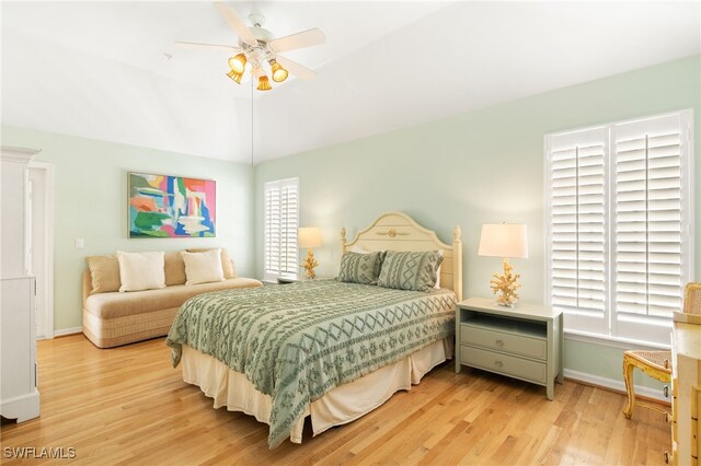 11533 Andy Rosse Ln, Captiva, FL 33924 - bedroom with light wood-type flooring, baseboards, ceiling fan, and lofted ceiling