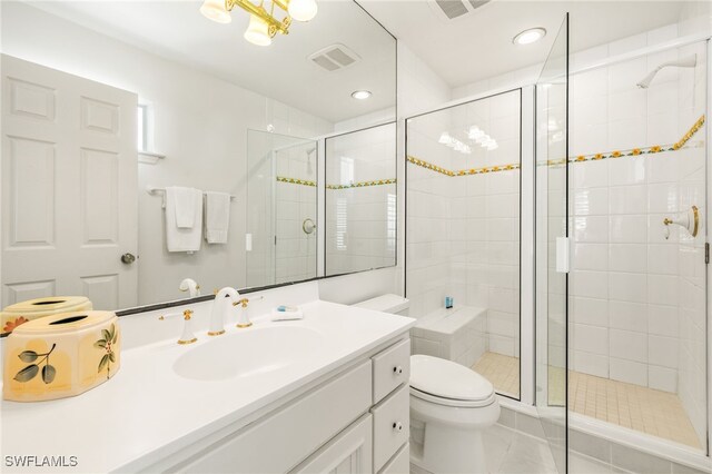 11533 Andy Rosse Ln, Captiva, FL 33924 - bathroom with toilet, vanity, a shower stall, tile patterned floors, and recessed lighting
