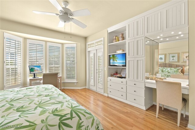 11533 Andy Rosse Ln, Captiva, FL 33924 - bedroom with light wood-style floors, multiple windows, baseboards, and a ceiling fan