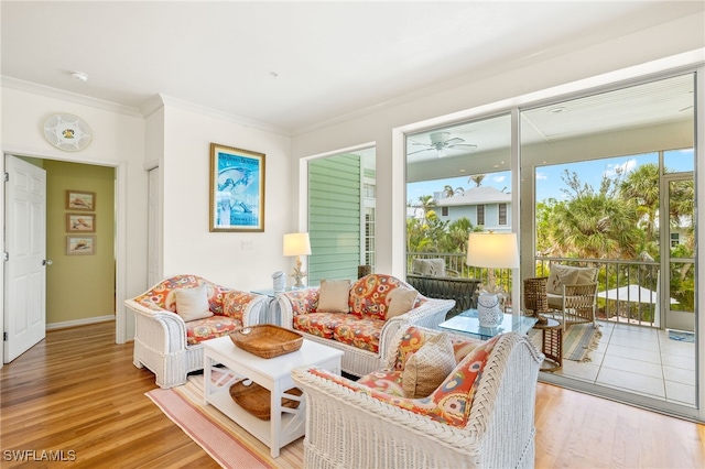 11533 Andy Rosse Ln, Captiva, FL 33924 - living area with wood finished floors, ornamental molding, ceiling fan, and baseboards