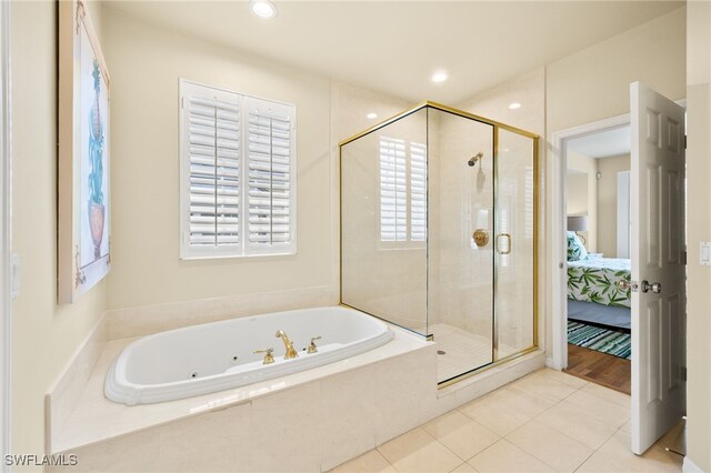 11533 Andy Rosse Ln, Captiva, FL 33924 - full bathroom with a jetted tub, a shower stall, connected bathroom, tile patterned floors, and recessed lighting