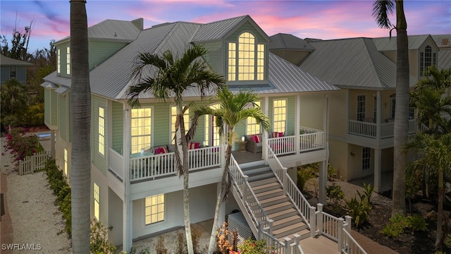 11533 Andy Rosse Ln, Captiva, FL 33924 - rear view of house with covered porch and metal roof