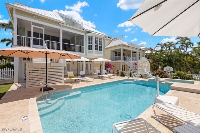 11533 Andy Rosse Ln, Captiva, FL 33924 - view of pool with stairs, a patio, a sunroom, a pool with connected hot tub, and ceiling fan