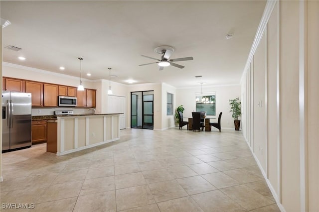 10996 Cherry Laurel Dr, Fort Myers, FL 33912 - kitchen with appliances with stainless steel finishes, brown cabinetry, open floor plan, dark countertops, and crown molding