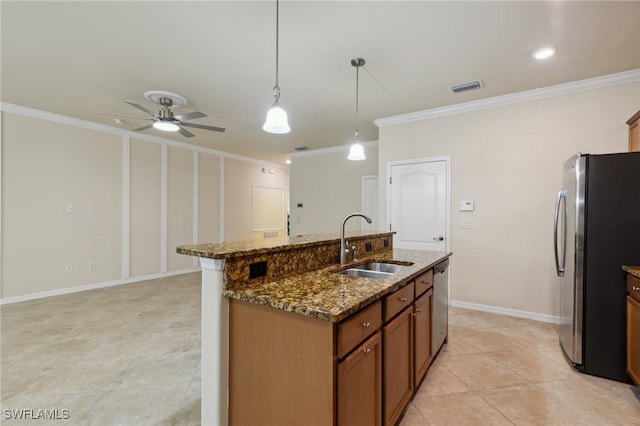 10996 Cherry Laurel Dr, Fort Myers, FL 33912 - kitchen with appliances with stainless steel finishes, crown molding, a sink, brown cabinetry, and an island with sink
