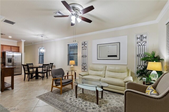 10996 Cherry Laurel Dr, Fort Myers, FL 33912 - living room featuring ornamental molding, light tile patterned floors, a ceiling fan, and baseboards